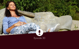 Midlife woman relaxing on a bench in the sun