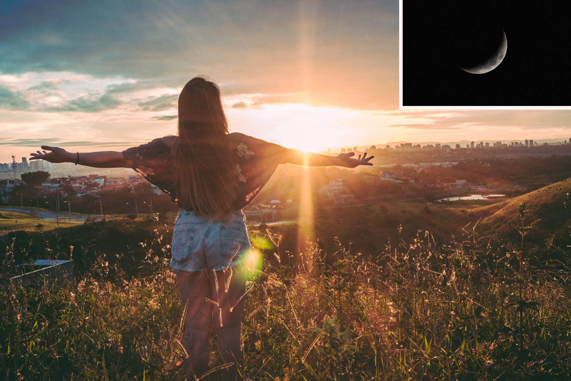 Photo of a person with long hair, lose shirt and shorts, back to the viewer, standing on a little green hill overlooking the area, the silhouette of a city in the distance; they have their arms spread open wide as if to welcome the sun that's appearing and rising on the horizon; in the upper right corner, there's the image of a waxing moon